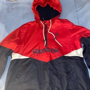 A women’s brand new REEBOK jacket. New with tags. Inside is white, fleece lined.
